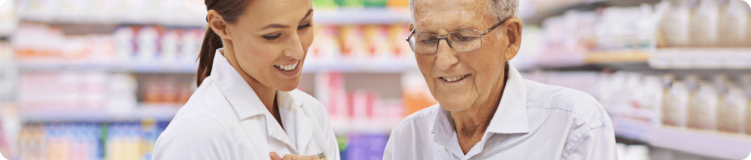 Woman and man talking in pharmacy