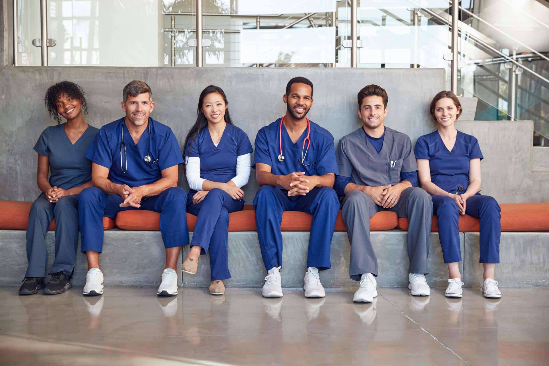 Healthcare workers sitting in a modern hospital