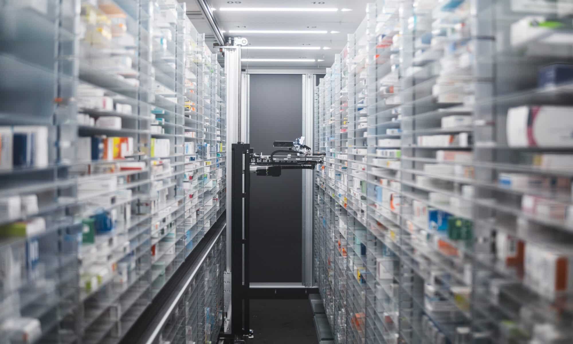 Narrow pharmacy aisle flanked by towering shelves stocked with medicine boxes. A pharmacy robot navigates through, ensuring efficient and precise medication retrieval.